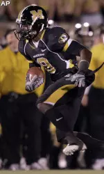 Jeremy Maclin, left, runs past Kansas State defensive end Ian Campbell, right, after catching a pass and running it in 42-yards for a touchdown during the second quarter. (AP Photo/Jeff Roberson)