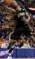 Marcus Denmon saves the ball from going out of bounds in the first half.