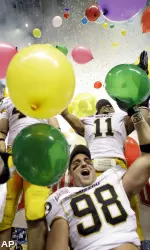 Tru Vaughns and Bart Coslet celebrate on the Alamodome turf following Mizzou's overtime win over Northwestern.