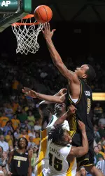 Missouri's Leo Lyons, right, drives over Baylor's Tweety Carter (45) and Mamadou Diene for a basket in the second (AP Photo)