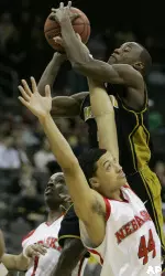 Keon Lawrence tries to shoot despite the tight defense by Nebraska guard Ryan Anderson during the first half . (AP Photo/Charlie Riedel)