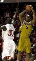 Missouri forward Leo Lyons (5) goes up to shoot against the defense of Oklahoma center Longar Longar (30) during first half action. (AP Photo/Alonzo Adams)