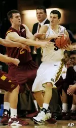 Iowa State's Jamie Vanderbeken tries to get the ball from Matt Lawrence during the first half. (AP Photo/L.G. Patterson)