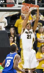 Laurence Bowers, right, dunks the ball over UMKC's Jay Couisnard, left, during the first half.