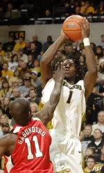 DeMarre Carroll shoots two of his game-high 13 points over Nebraska's Ade Dagunduro during the second half. (AP Photo/L.G. Patterson)