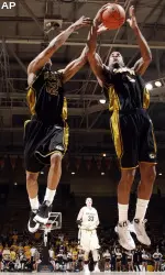 Marcus Denmon and forward Leo Lyons go up for a rebound versus Colorado.