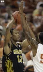 Marcus Denmon, left, is defended by Texas guard Varez Ward during the first half.