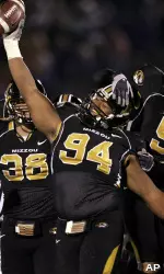 In this file photo, Evander Hood is congratulated by teammates Stryker Sulak (38) and Van Alexander (5) after recovering a fumble during the fourth quarter. (AP Photo/Jeff Roberson)