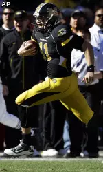 Missouri quarterback Blaine Gabbert looks for running room during the first half.