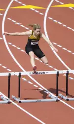 <i>Leslie Farmer broke her own school record in the 400m hurdles.</i>