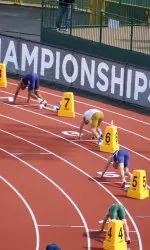 <i>Lars Rise (lane six) prepares for the decathlon 400m dash.</i>