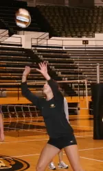 <i>Molly Kreklow teaches the campers how to set a volleyball.</i>