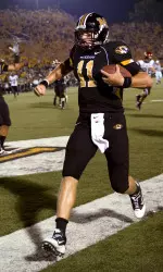 (AP) Quarterback Blaine Gabbert, center, celebrates at the end of an 11-yard touchdown run during the second quarter.