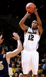 Marcus Denmon puts up a shot over Navy defense. Denmon scored 22 points to lead the Tigers.