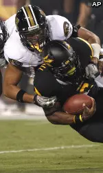 Arizona State running back Cameron Marshall is tackled by defensive lineman Brad Madison and defensive back E.J. Gaines during the first quarter on Friday, Sept. 9, 2011, in Tempe, Ariz. (AP Photo/Matt York)