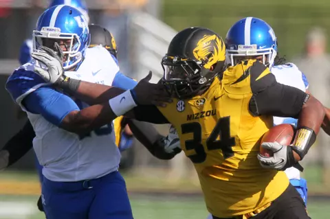 Missouri defensive lineman Sheldon Richardson (34) tries to fend off Kentucky quarterback Jalen Whitlow as he returns a fumble 60 yards during the first quarter of an NCAA college football game on Saturday, Oct. 27, 2012, at Faurot Field in Columbia, Mo. Sweat recovered the fumble. (AP Photo/St. Louis Post-Dispatch, Chris Lee,) EDWARDSVILLE INTELLIGENCER OUT; THE ALTON TELEGRAPH OUT