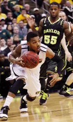 Missouri Tigers guard Phil Pressey gets past Baylor guard Pierre Jackson