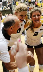 <i>Head coach Wayne Kreklow gives praise to a happy group of Tigers.</i>
