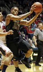 Jabari Brown tries to shoot around Mississippi guard Marshall Henderson (22). (AP Photo/Rogelio V. Solis)