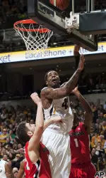 Alex Oriakhi shoots over Georgia's Kenny Gaines.