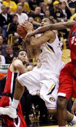 Jabari Brown draws contact near the basket.
