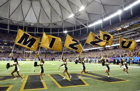 Dec 7, 2013; Atlanta, GA, USA; The Missouri Tigers cheerleaders celebrate a touchdown against the Auburn Tigers during the second quarter of the 2013 SEC Championship game at Georgia Dome. Mandatory Credit: John David Mercer-USA TODAY Sports