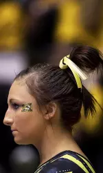 Updike earned her fifth event title of the season with a 9.950 score on the vault.