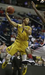 Missouri guard Phil Pressey (1) passes the ball as Mississippi forward Murphy Holloway (31) defends. (AP Photo/John Bazemore)