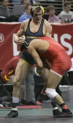 Senior Mike Larson collected his 100th win in his collegiate career. Junior Alan Waters also reached that milestone in Friday's quarterfinals.