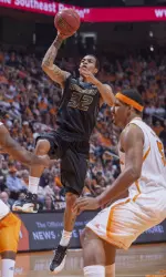 Jabari Brown (32) shoots against Tennessee. (AP Photo/Knoxville News Sentinel, Adam Brimer)