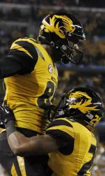 Wide receiver Marcus Lucas (85) celebrates scoring a touchdown with running back Henry Josey (20) in the second quarter.
