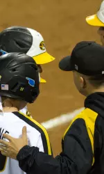 Head coach Ehren Earleywine instructs the Tigers during 2013 action