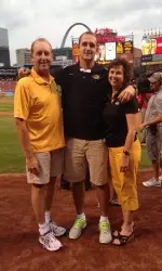 Ryan Rosburg and his family on the field at Busch Stadium during Mizzou Night.