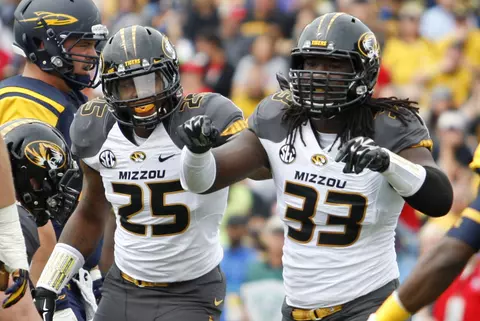 Missouri Tigers linebacker Donavin Newsom (25) and defensive lineman Markus Golden (33) react after a play against the Toledo Rockets during the first quarter at Glass Bowl. Raj Mehta-USA TODAY Sports