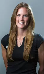 Jr. Kelli Hine went a perfect 2-0 in singles play Friday in Wichita, Kan.