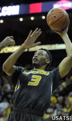 Johnathan Williams III (3) shoots the ball.