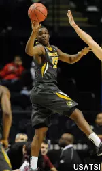 Montaque Gill-Caesar (13) passes the ball to guard Namon Wright (12).