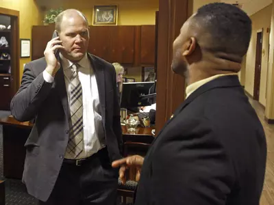 Coach Odom gets a phone call.