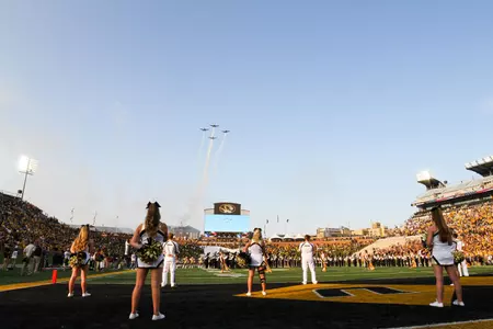 cheerleaders with flyover