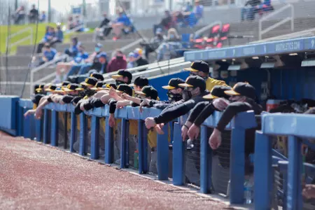 Team in dugout at Kentucky