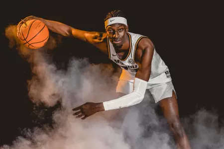 mohamed diarra dribbling in white Mizzou uniform