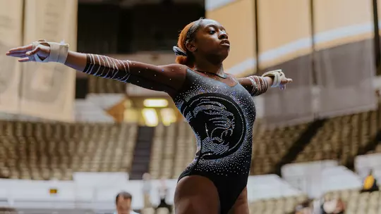 Hannah Horton competes on floor at Black and Gold Meet