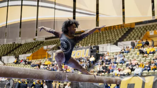 Amari Celestine on beam at Black and Gold Meet