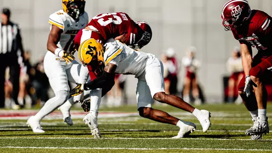 Sidney Williams makes a tackle against UMass