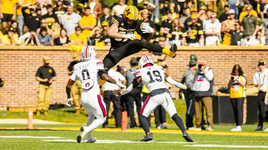 Brett Norfleet jumps over a defender during Mizzou's game against Auburn