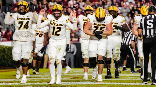 Brady Cook and the rest of the team celebrate after a touchdown against South Carolina