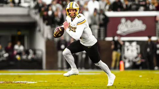 Brady Cook scambles against Mississippi State