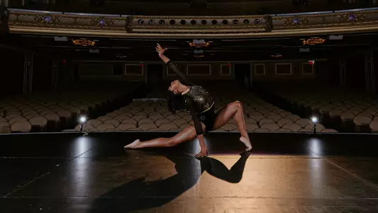Railey Jackson of the Mizzou gymnastics team posing on stage.