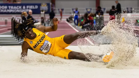 Sterling Scott landing during a jump at the SEC Indoor Championships in Feb. 2024.