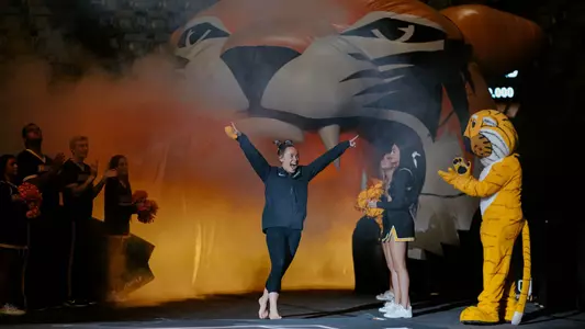 Graduate Abby Mueller comes out of the tunnel as she is announced prior to the Mizzou gymnastics team's annual Black & Gold Intrasquad exhibition.